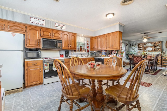 2530 Robin Ln, Garland, TX 75041 - dining room with a textured ceiling, crown molding, and a ceiling fan