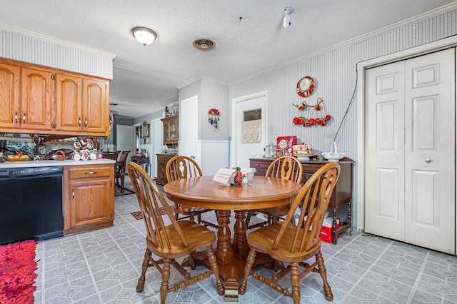 2530 Robin Ln, Garland, TX 75041 - dining space with ornamental molding and a textured ceiling