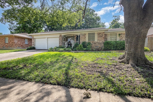2530 Robin Ln, Garland, TX 75041 - view of front of property with brick siding, an attached garage, driveway, and a front yard