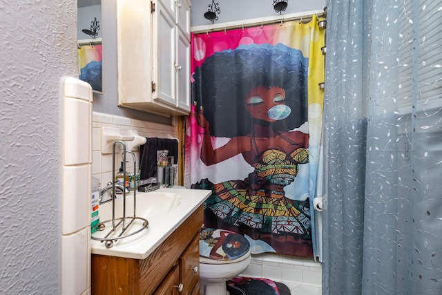 2530 Robin Ln, Garland, TX 75041 - full bath with vanity, a shower with shower curtain, a textured wall, and tile patterned flooring