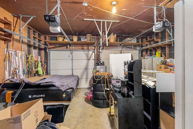 2530 Robin Ln, Garland, TX 75041 - garage featuring a garage door opener and freestanding refrigerator