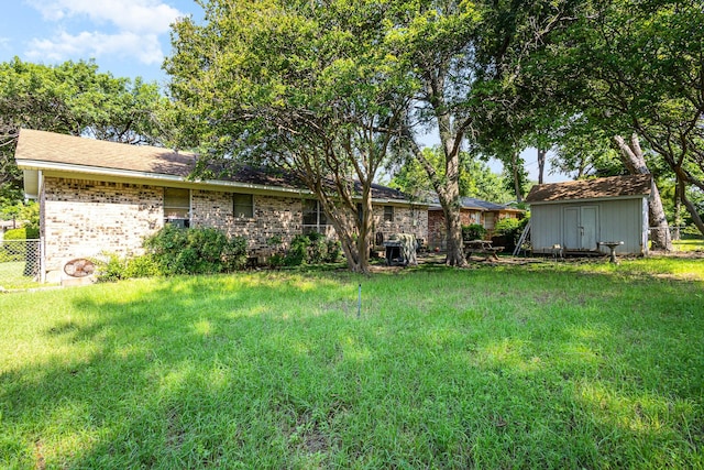 2530 Robin Ln, Garland, TX 75041 - rear view of property with a storage shed and brick siding