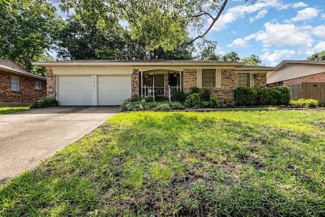 2530 Robin Ln, Garland, TX 75041 - view of front of property with brick siding, an attached garage, and driveway