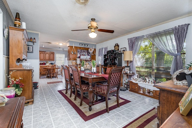 2530 Robin Ln, Garland, TX 75041 - dining area with crown molding, a ceiling fan, and a textured ceiling