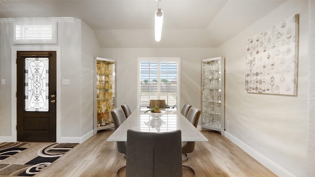 1530 Petaluma Dr, Rockwall, TX 75087 - dining area with light wood-style floors, baseboards, and lofted ceiling
