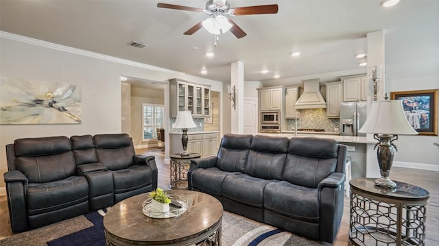 1530 Petaluma Dr, Rockwall, TX 75087 - living room with wood finished floors, baseboards, ceiling fan, recessed lighting, and ornamental molding