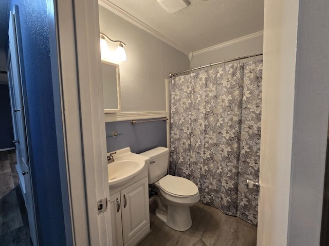 106 Mcanally Dr, Mabank, TX 75147 - bathroom with wood finished floors, ornamental molding, toilet, vanity, and a shower with shower curtain