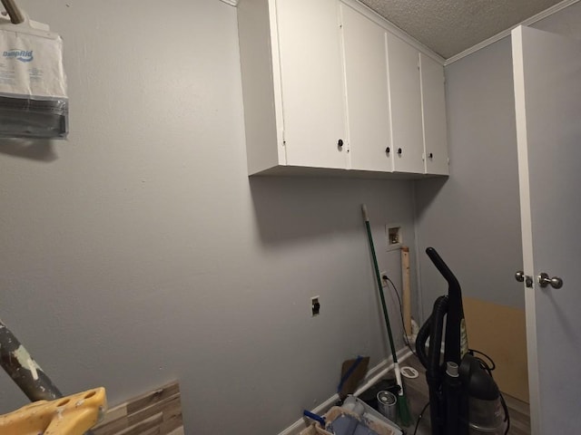 106 Mcanally Dr, Mabank, TX 75147 - washroom with cabinet space, hookup for an electric dryer, and a textured ceiling