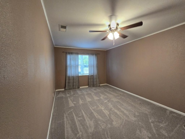 106 Mcanally Dr, Mabank, TX 75147 - spare room featuring a ceiling fan, carpet, baseboards, ornamental molding, and a textured wall