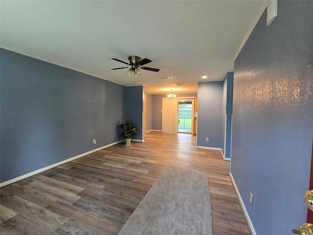 106 Mcanally Dr, Mabank, TX 75147 - spare room featuring wood finished floors, a ceiling fan, baseboards, ornamental molding, and recessed lighting
