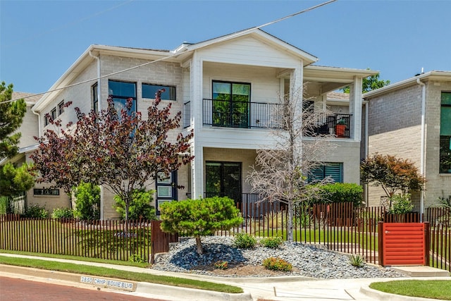 1328 Madeline Pl Unit B, Fort Worth, TX 76107 - view of front of house with a balcony and a fenced front yard