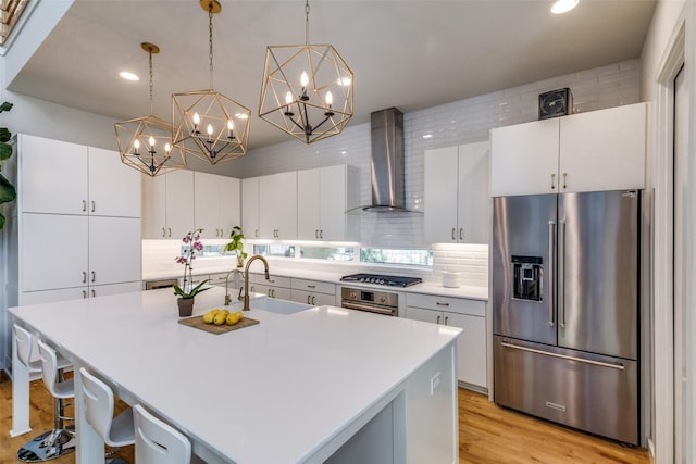 1328 Madeline Pl Unit B, Fort Worth, TX 76107 - kitchen featuring stainless steel appliances, wall chimney exhaust hood, a sink, tasteful backsplash, and light countertops