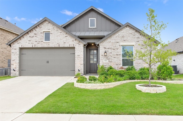 3728 Cherry Hills Dr, Sherman, TX 75090 - view of front of home with board and batten siding, a front yard, concrete driveway, an attached garage, and brick siding