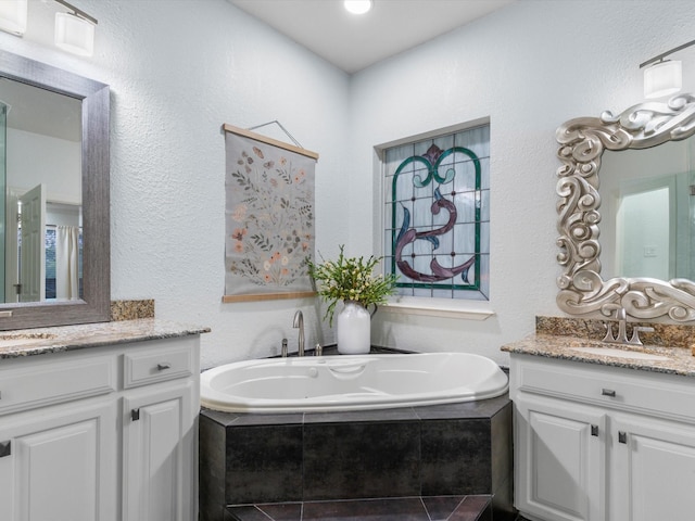 9120 Timber Oaks Dr, Fort Worth, TX 76179 - bathroom featuring vanity, a bath, and a textured wall