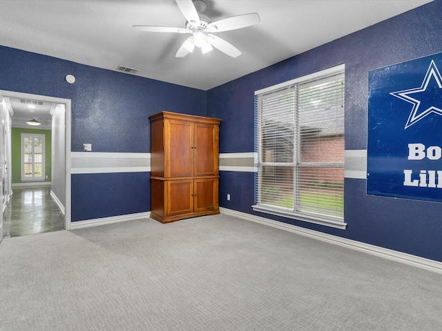 9120 Timber Oaks Dr, Fort Worth, TX 76179 - empty room with carpet floors, a textured wall, ceiling fan, and baseboards