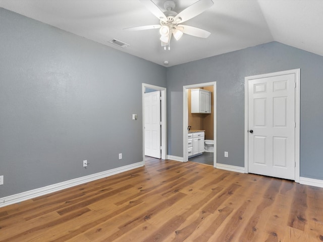 9120 Timber Oaks Dr, Fort Worth, TX 76179 - unfurnished bedroom with wood finished floors, lofted ceiling, baseboards, connected bathroom, and a ceiling fan