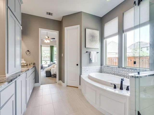 8542 Gerbera Daisy Rd, Frisco, TX 75035 - ensuite bathroom with a garden tub, ceiling fan, vanity, tile patterned floors, and a stall shower