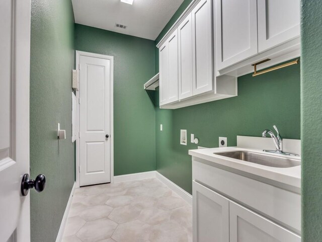 8542 Gerbera Daisy Rd, Frisco, TX 75035 - laundry area featuring hookup for an electric dryer, hookup for a washing machine, and cabinet space