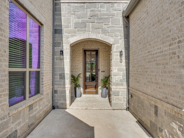 8542 Gerbera Daisy Rd, Frisco, TX 75035 - property entrance featuring brick siding and stone siding