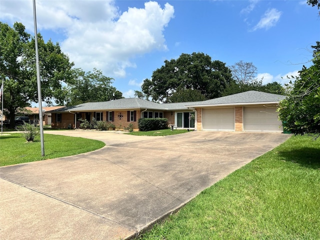 720 Robindale, Fairfield, TX 75840 - single story home with driveway, brick siding, a front lawn, and a garage