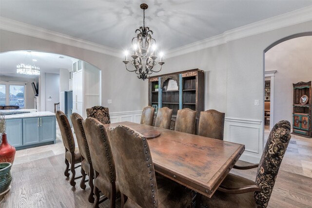 253 Bayne Rd, Haslet, TX 76052 - living area featuring a high ceiling, ornamental molding, arched walkways, a fireplace, and wood finished floors