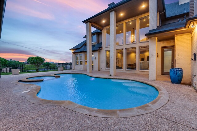253 Bayne Rd, Haslet, TX 76052 - pool at dusk with a patio area and a pool with connected hot tub