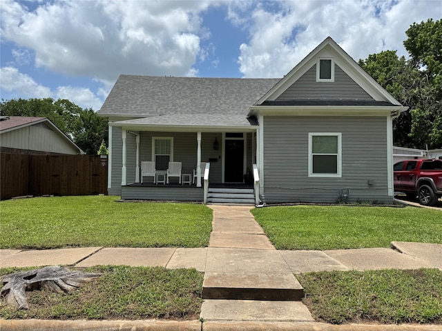 819 Beech St, Bonham, TX 75418 - view of front facade with covered porch and a shingled roof