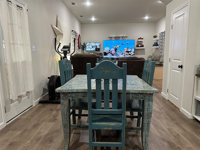 819 Beech St, Bonham, TX 75418 - dining area with wood finished floors and baseboards