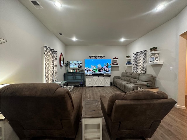 819 Beech St, Bonham, TX 75418 - living area featuring dark wood-style floors and recessed lighting