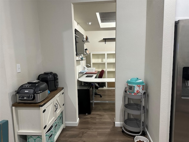 819 Beech St, Bonham, TX 75418 - spacious closet featuring dark wood-style floors