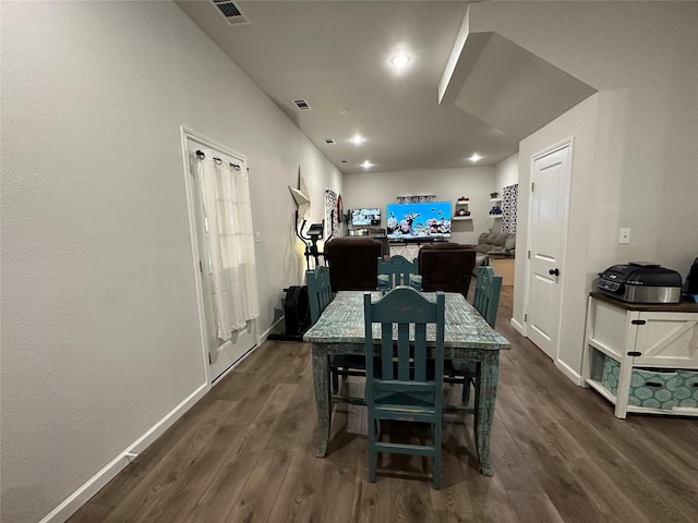 819 Beech St, Bonham, TX 75418 - dining room featuring dark wood-type flooring and baseboards