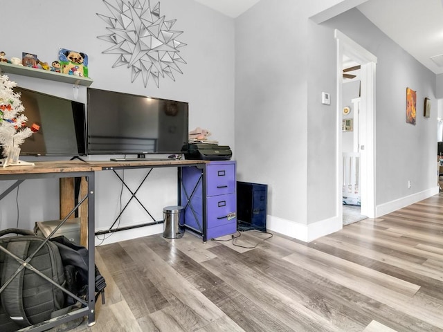 401 S 2nd St, Wortham, TX 76693 - office area with wood finished floors and baseboards