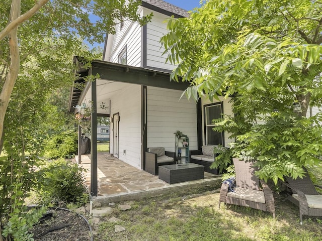 401 S 2nd St, Wortham, TX 76693 - back of house featuring a patio