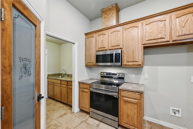 8109 County Road 804, Burleson, TX 76028 - kitchen with appliances with stainless steel finishes and light stone countertops