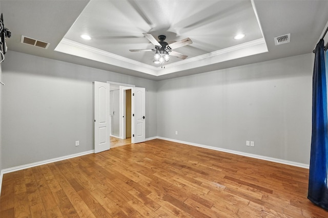 8109 County Road 804, Burleson, TX 76028 - unfurnished bedroom featuring a raised ceiling, crown molding, light wood finished floors, recessed lighting, and a ceiling fan