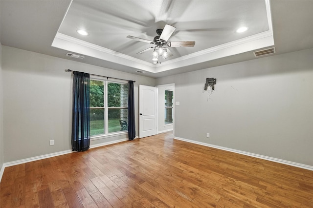8109 County Road 804, Burleson, TX 76028 - spare room featuring a raised ceiling, crown molding, hardwood / wood-style flooring, a ceiling fan, and recessed lighting