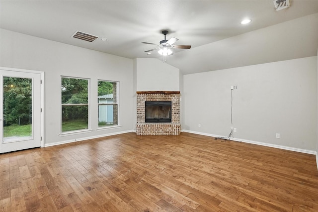 8109 County Road 804, Burleson, TX 76028 - unfurnished living room featuring ceiling fan, wood finished floors, a fireplace, recessed lighting, and vaulted ceiling