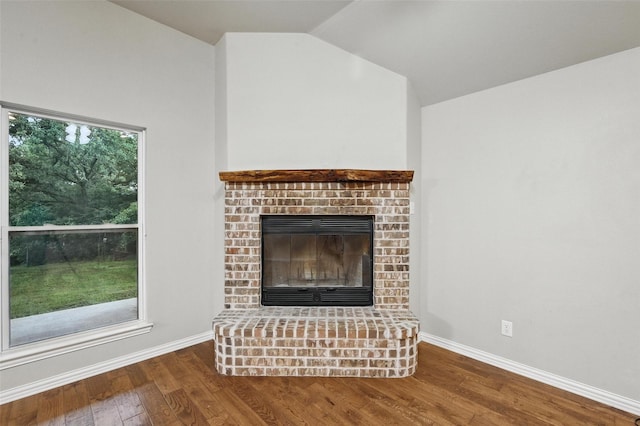 8109 County Road 804, Burleson, TX 76028 - unfurnished living room with wood finished floors, a fireplace, and vaulted ceiling