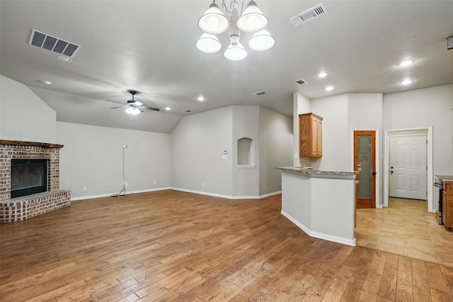 8109 County Road 804, Burleson, TX 76028 - unfurnished living room with a ceiling fan, light wood-style floors, lofted ceiling, a brick fireplace, and recessed lighting