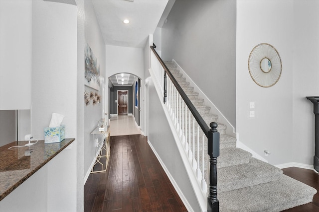 4304 Wildbriar Ln, Mansfield, TX 76063 - stairway featuring arched walkways, hardwood / wood-style floors, baseboards, and recessed lighting