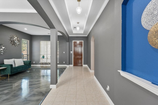 4304 Wildbriar Ln, Mansfield, TX 76063 - entryway with arched walkways, baseboards, ornamental molding, a tray ceiling, and tile patterned floors
