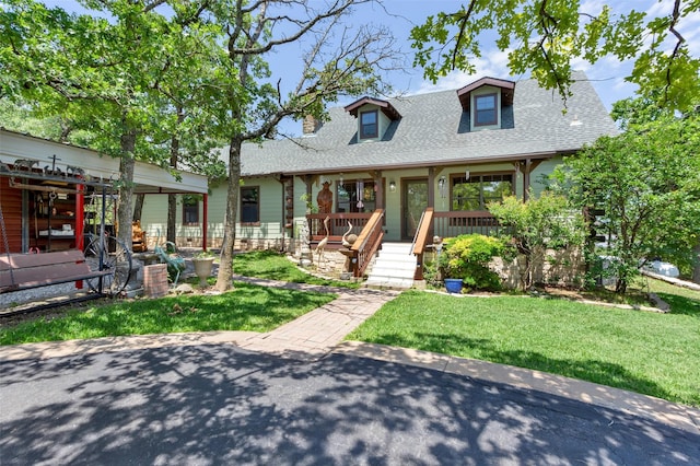 161 Cheyenne Dr, Nocona, TX 76255 - cape cod home featuring a shingled roof, covered porch, and a front lawn
