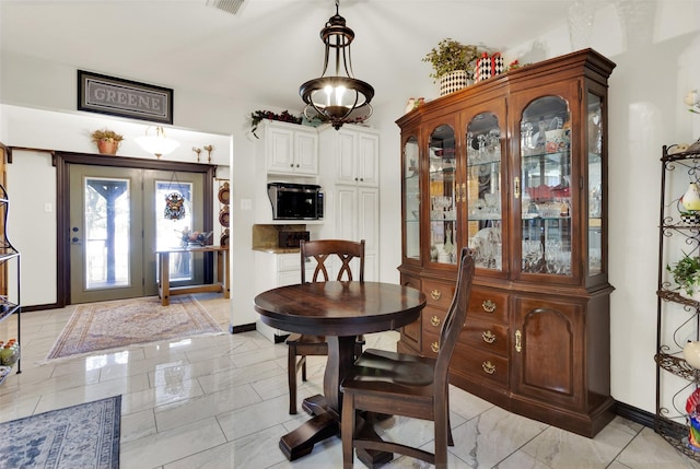 161 Cheyenne Dr, Nocona, TX 76255 - dining space featuring baseboards and light marble finish floors