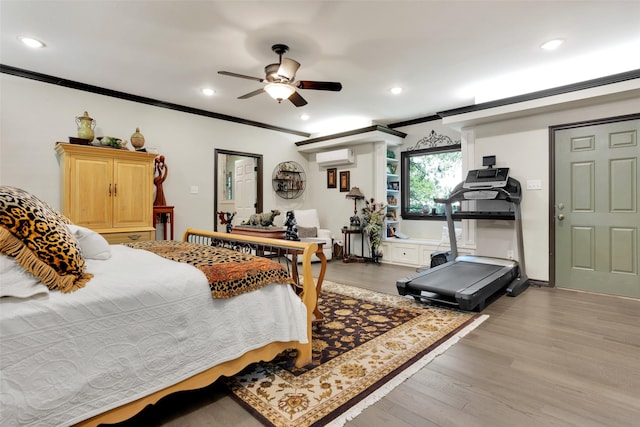 161 Cheyenne Dr, Nocona, TX 76255 - bedroom featuring crown molding, recessed lighting, wood finished floors, a wall mounted AC, and ceiling fan