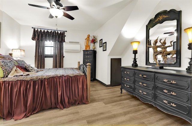 161 Cheyenne Dr, Nocona, TX 76255 - bedroom with light wood-style floors, an AC wall unit, ceiling fan, and baseboards