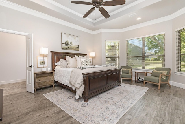 3011 Skyhawk Dr, Granbury, TX 76049 - bedroom with a tray ceiling, ornamental molding, wood finished floors, baseboards, and a ceiling fan
