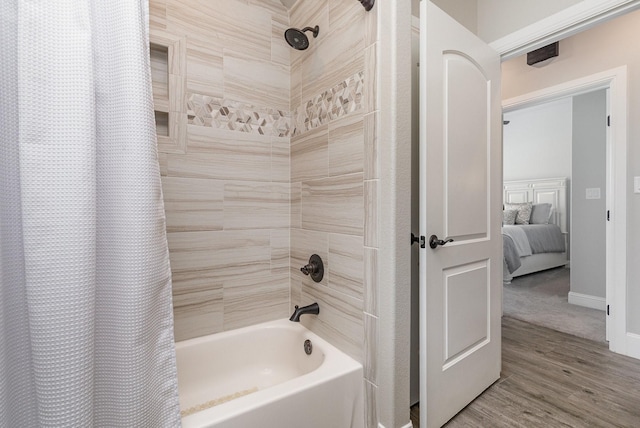 3011 Skyhawk Dr, Granbury, TX 76049 - ensuite bathroom with shower / tub combo, wood finished floors, and baseboards