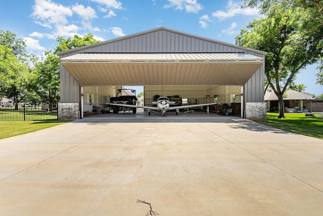 3011 Skyhawk Dr, Granbury, TX 76049 - view of parking / parking lot featuring a carport and concrete driveway