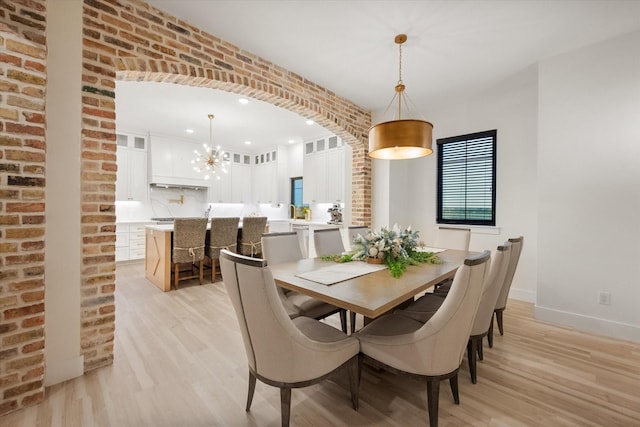 1911 Ozro Rd, Venus, TX 76084 - dining area featuring light wood finished floors, a chandelier, and recessed lighting