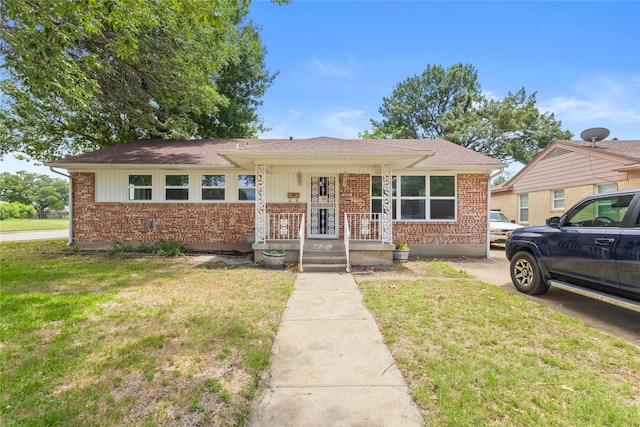 10270 Kilkenny Pl, Dallas, TX 75228 - view of front of home featuring brick siding, a front yard, and roof with shingles